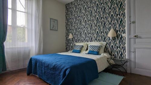 Postel nebo postele na pokoji v ubytování Le Jardin des Lys - Chambre d'hôte ou Appartement