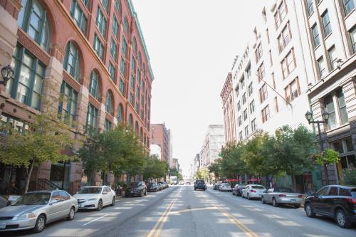 a city street with parked cars and buildings at Marriott St. Louis Grand in Saint Louis