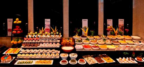 a buffet with many different types of food on display at Fortune Park JPS Grand Rajkot - Member ITC Hotels' Group in Rajkot