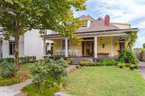 a yellow house with a lawn in front of it at Captain's Quarters East Nashville, Tn (Five Point) in Nashville