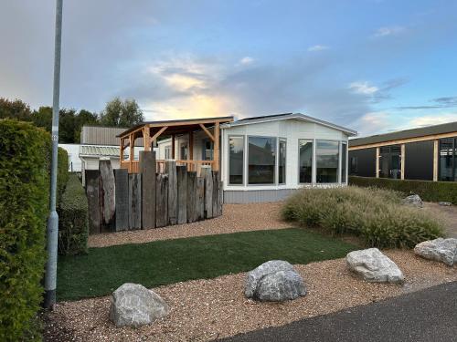 a house with rocks in front of it at Maison Louise in Sint Annaland