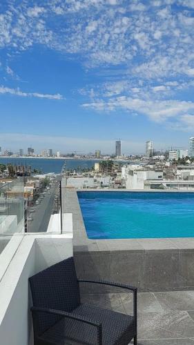 a swimming pool on the roof of a building at Departamento en Mazatlán Torre Zuñiga in Mazatlán