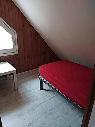 Tempat tidur dalam kamar di Gite d'alexis
