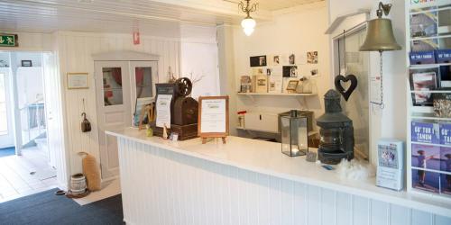 a shop with a counter in a room at Kustnära Vandrarhem in Hamburgsund