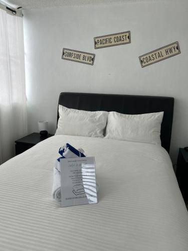 a white bed with a box on top of it at Peaceful Luxury Villa - TheShine&GlowPlace in Fajardo