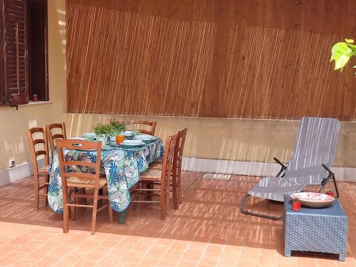 a table and chairs sitting on a patio at La casa dei pesci dipinti in Castelluzzo