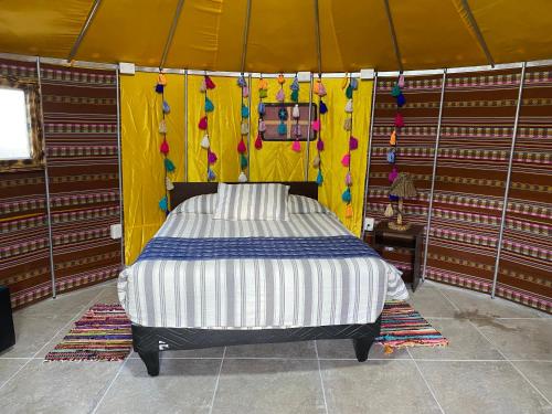Postel nebo postele na pokoji v ubytování Altos de Quitor, Glamping