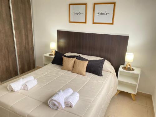 Ένα ή περισσότερα κρεβάτια σε δωμάτιο στο Piccoletto apartamento