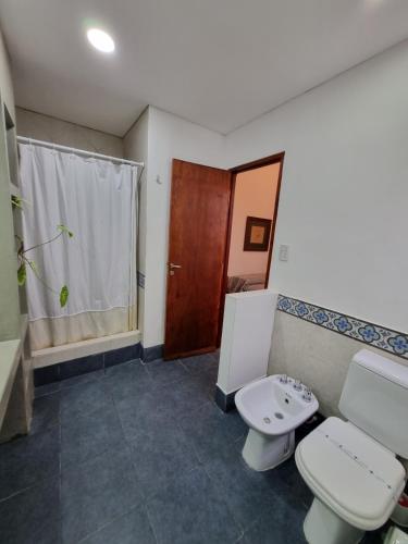 a bathroom with two toilets and a sink at Terraza de la Usina in Salta
