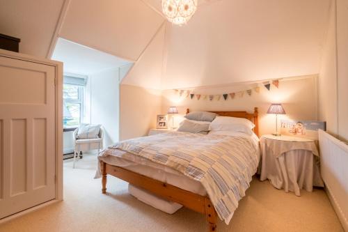 En eller flere senge i et værelse på Sandy Lodge Rock