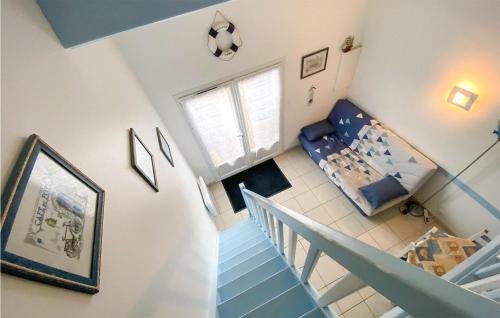 an overhead view of a living room with a staircase at Stunning Home In La Faute Sur Mer in La Faute-sur-Mer
