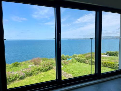 a view of the ocean from a window at The Old Coastguard Lookout in Port Isaac