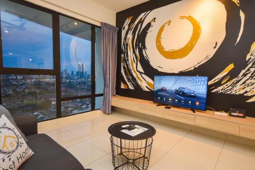 a living room with a tv and a large window at Midvalley Southkey Mosaic Suite by Nest Home in Johor Bahru