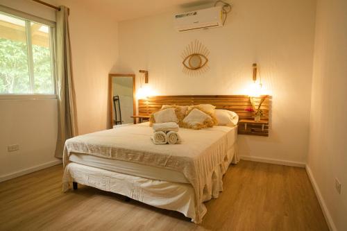 a bedroom with a large white bed in a room at Casa Arena 2 in Big Creek