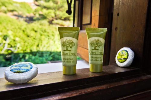 two bottles of lime tree products sitting on a window sill at Pegasus in Masouri