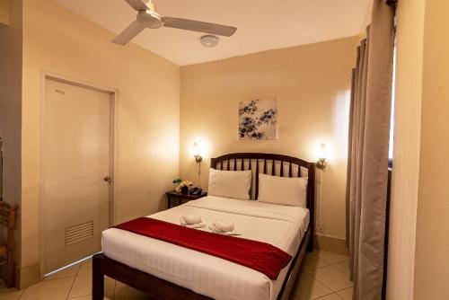 Katil atau katil-katil dalam bilik di Kiwi Hotel