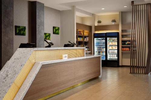 a lobby of a store with a cash register at SpringHill Suites by Marriott Milpitas Silicon Valley in Milpitas