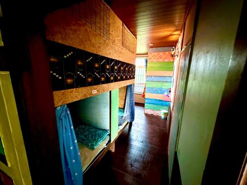 a room with a shelf with wine bottles at Happy Island Miyako in Miyako Island