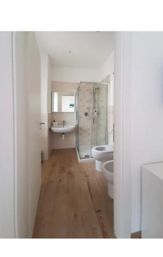 a bathroom with a shower and a toilet and a sink at B&b CasaCapaldo in Naples