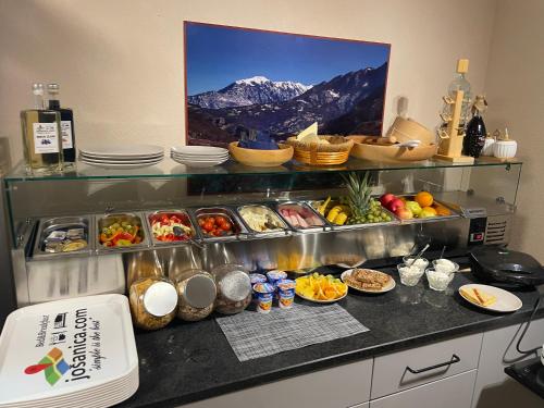 a kitchen with a bunch of food on a counter at Josanica Bed&Breakfast in Konjic