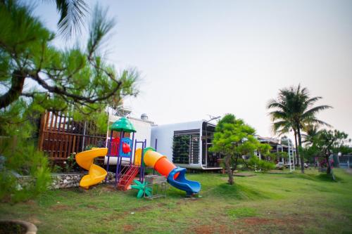 a playground with a slide in a yard at Homestay Papa garden in Pleiku