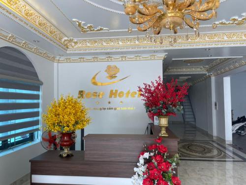 a room with two vases of flowers on a table at Rose hotel 