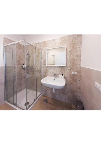 a bathroom with a sink and a shower at B&b CasaCapaldo in Naples