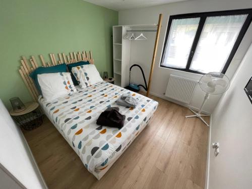 En eller flere senge i et værelse på Ô’Bon’Endroit By Audrey & Thomas