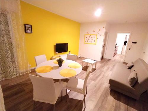 a living room with a table and a couch at Casa Cristina “a Ragusa” in Ragusa
