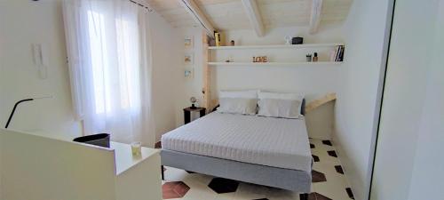 Postel nebo postele na pokoji v ubytování Diaz 22 Casa Vacanza