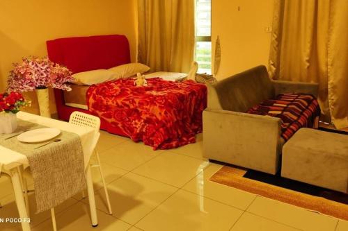 a living room with a bed and a table and chairs at CQ1101- SELF CHECK-IN- WI-FI - NETFLIX-PARKING-BALCONY- CYBERJAYa, 2063 in Cyberjaya