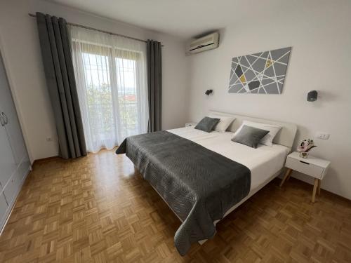 מיטה או מיטות בחדר ב-Magnolia Apartments
