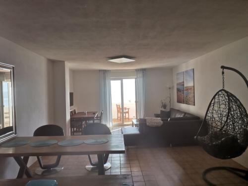 a living room with a table and a couch at Apartments Alma in Pag