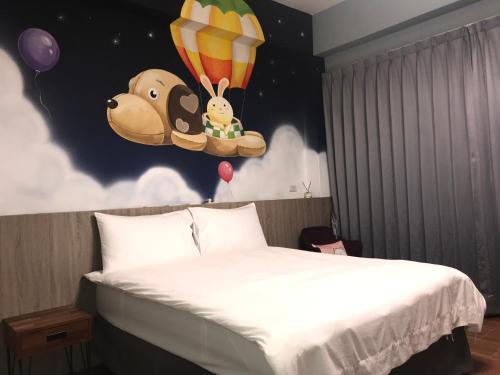 Cama o camas de una habitación en 蘑菇城堡民宿