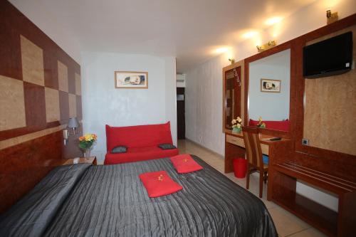 Ένα ή περισσότερα κρεβάτια σε δωμάτιο στο Hotel Le Richmont