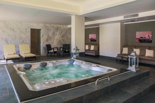 a jacuzzi tub in a hotel room at JAZ Aquaviva in Hurghada