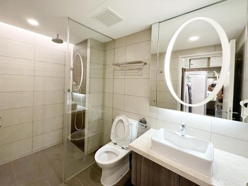 a bathroom with a toilet and a sink and a mirror at The BEST @ Genting Highland ( FREE WIFI ) in Genting Highlands