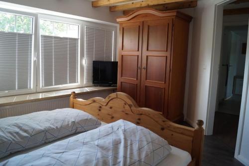 Postel nebo postele na pokoji v ubytování Ferienwohnung Ankerplatz in Schlagsdorf auf Fehmarn