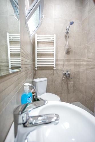 a bathroom with a sink and a toilet at city point in Kutaisi