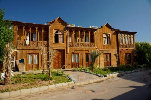 a large wooden house with a road in front of it at Adel's villa in Sharm El Sheikh