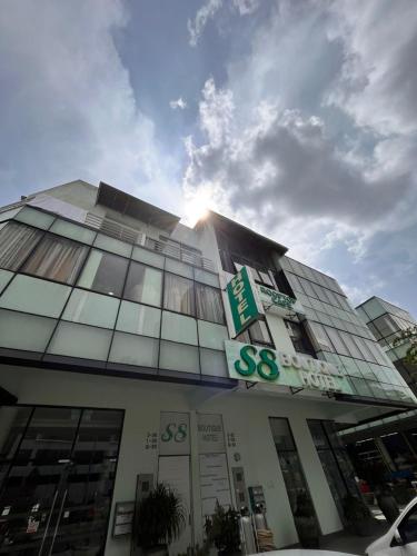 a building with a sign on the front of it at S8 Boutique Hotel near KLIA 1 & KLIA 2 in Sepang
