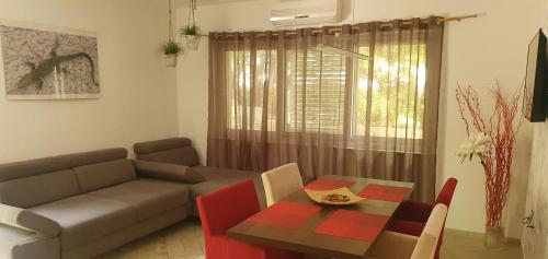 a living room with a couch and a table at Apartments Stari Pavle in Brela