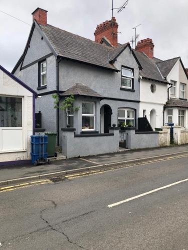 a house on the side of a street at Penchwintan in Bangor