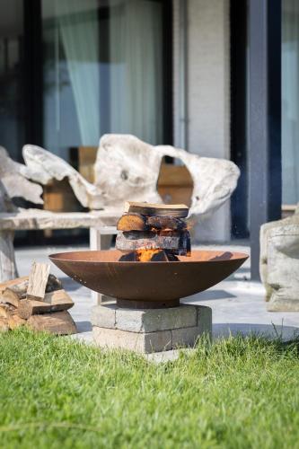 a bowl of food sitting on top of a table at Villa Polderzicht, private luxurious stunning views in Cadzand