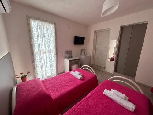 Postel nebo postele na pokoji v ubytování B & B Da Rosa