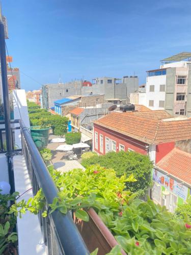 a view of a city from a balcony at Quarto Nº5 FANTASTIQUE- Central Praia in Praia