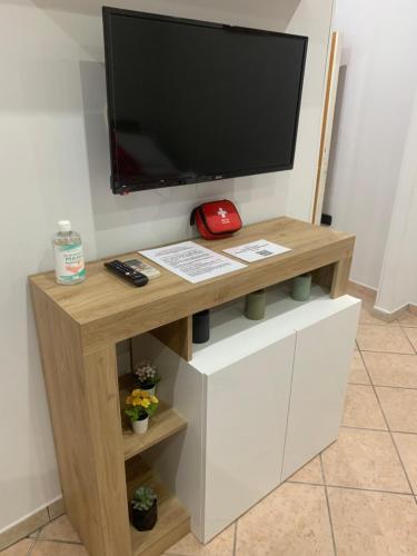 A television and/or entertainment centre at San Ciro's apartment
