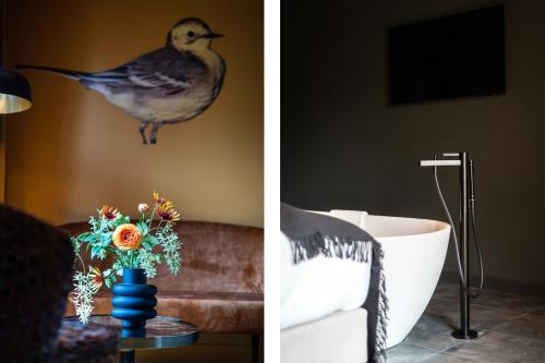 a bird sitting on a wall next to a living room at Prins Hendrik Texel in Oost