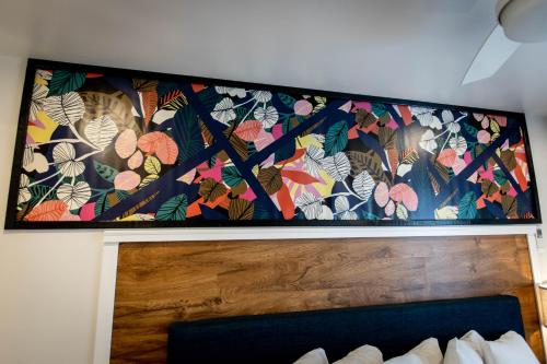 a tapestry hanging above a bed in a room at Ocean View Terrace in Hampton Bays
