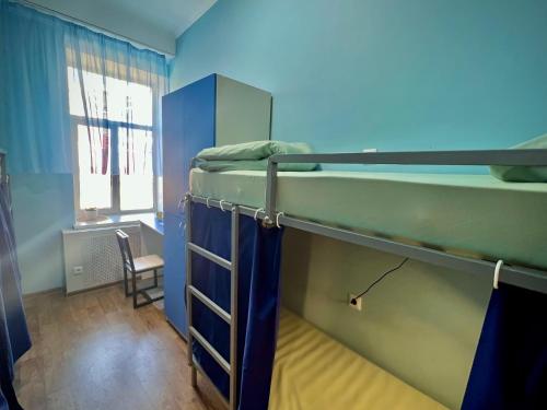 a room with two bunk beds and a chair at Hostel on Universytet in Kyiv